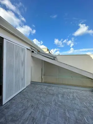 an empty garage with a roof at The White Lodge in Porticello