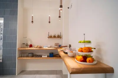a kitchen with a counter with fruit on it at Acquamarina Rooms in Castellammare del Golfo