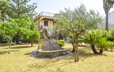 a house in the middle of a park with trees at 3 Bedroom Lovely Home In Borgetto in Borgetto