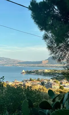 a view of a city and a body of water at The White Lodge in Porticello