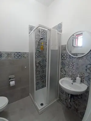a bathroom with a shower and a sink at Sicilia House bluchic in Isola delle Femmine