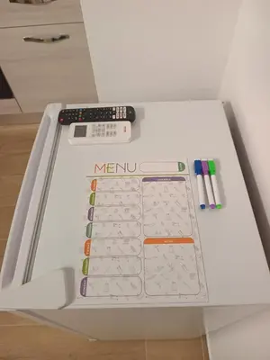 a machine with a keyboard and two remote controls on it at Talia Capo Massimo in Palermo