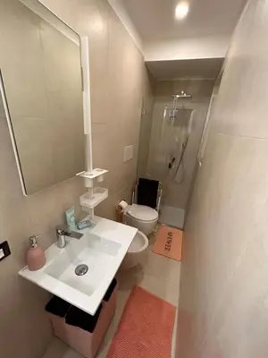 a bathroom with a sink and a toilet and a mirror at margot palermo in Palermo