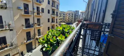 a balcony with a bunch of bananas on a building at Plumeria Vacanze in centro a Palermo- Isidoro Carini zona Politeama in Palermo