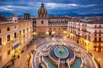 a view of a city with a fountain in the middle at Four Luxury Art in Palermo