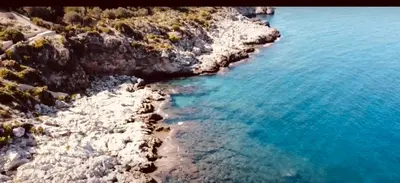 an aerial view of a rocky shore with blue water at Casa Lo Re in Bagheria