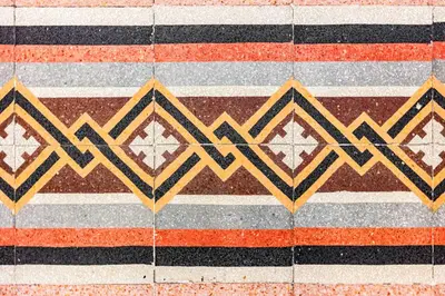 a tile floor with geometric patterns on it at Kepos Rooms and Suites in Palermo