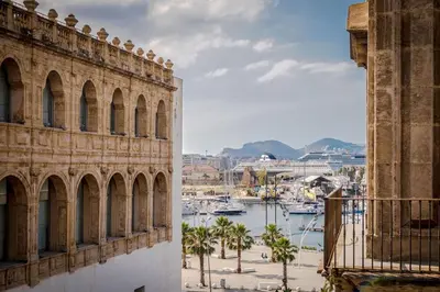 a view of a harbor from the side of a building at At Kalsa Quiet Flowered Terrace! Free Parking! Ideal for remote working! in Palermo