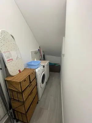 a laundry room with a washing machine and a washer at Mondello - La casa del vecchio pescatore in Palermo