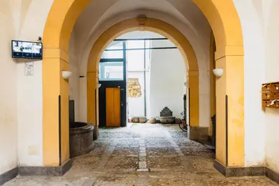 an empty hallway with an archway in a building at I Carrettieri - a few steps from the Cathedral in Palermo
