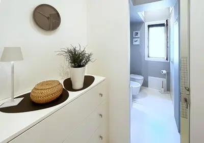 a bathroom with a counter with a hat on it at Solemar Sicilia - White Loft in Palermo
