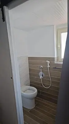 a bathroom with a toilet and a shower at VeraHouse in Palermo