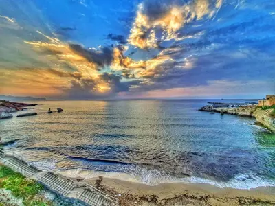 a view of a beach with stairs in the water at NONNO PEPPE Suites 1, 2 & 3 in Terrasini