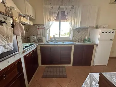 a kitchen with a sink and a counter top at Casetta Sferracavallo in Palermo