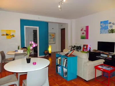 a living room with a couch and a table at In Itinera in Palermo