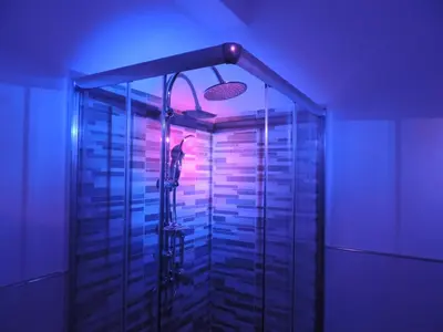a shower with purple lights in a room at In Itinera in Palermo