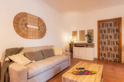 a living room with a couch and a coffee table at Casa Marina in Palermo