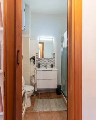 a bathroom with a sink and a toilet at Casa Marina in Palermo
