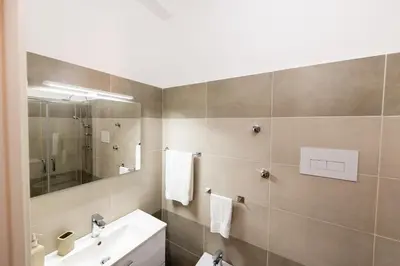 a bathroom with a sink and a mirror at Casa Mauro in Palermo