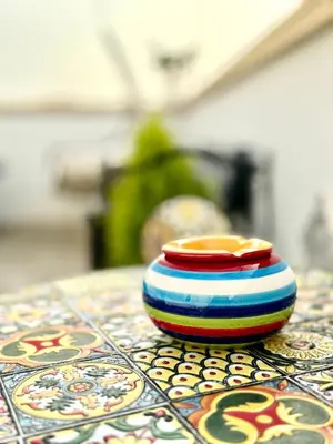 a colorful bowl sitting on top of a table at Le terrazze di Giulia in Palermo