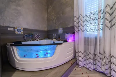a bathroom with a bath tub with a fish tank at Le terrazze di Giulia in Palermo