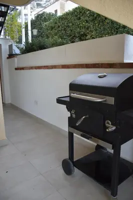 a black grill with a suitcase on top of it at Caladdaura in Palermo