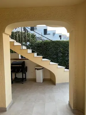a hallway with a staircase in a building with a trash can at Caladdaura in Palermo