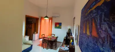 a living room with a painting on the wall at Abba Palermo centro in Palermo
