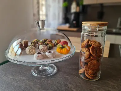 a plate of food on a table with a jar of food at Casa Zolì - Luxury House - 210mq in Palermo
