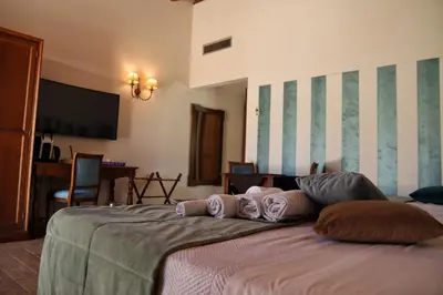 a bedroom with a bed with pillows on it at Villa Lampedusa in Palermo