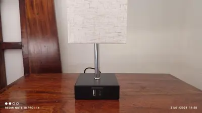 a lamp sitting on top of a wooden table at ViViHolidays in Castellammare del Golfo