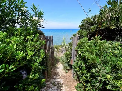 a path leading to the ocean through a fence at Apartment Luna by Interhome in Trappeto