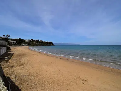a sandy beach with the ocean in the background at Apartment Luna by Interhome in Trappeto