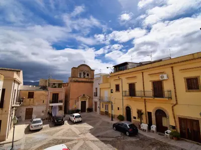 a group of buildings with cars parked in a parking lot at Apartment Stelle by Interhome in Trappeto