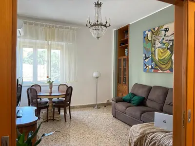 a living room with a couch and a table at Ekry Apartment in Palermo