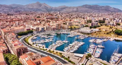 a city with boats docked in a harbor at Ai Bottonai Casa 23 in Palermo