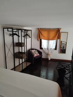 a bedroom with a bed and a window at BONELLUS in Palermo