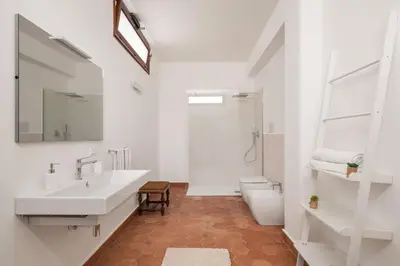 a bathroom with a sink and a toilet and a shower at Villa lady olimpia in Palermo