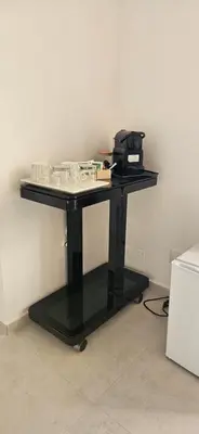 a black desk with a phone on top of it at Vintage Room Palermo in Palermo