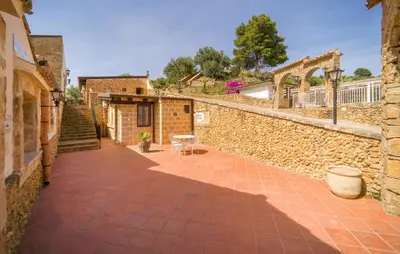 a courtyard in a house with a brick wall at Casale Del Golfo in Alcamo