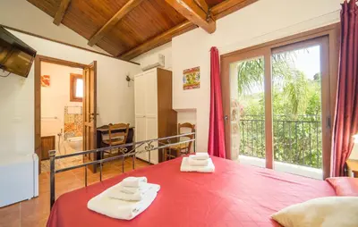 a room with a red table with towels on it at Casale Del Golfo in Alcamo