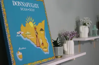 a poster of a map of dominica on a shelf at A' Nica room in Palermo