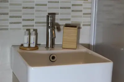 a bathroom sink with a faucet on it at A' Nica room in Palermo