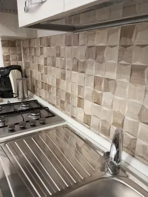a kitchen with a stove and a sink at Casa Chiaretta in Palermo