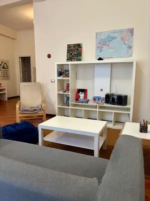a living room with a couch and a table at Castelnuovo Rooms #Politeama in Palermo