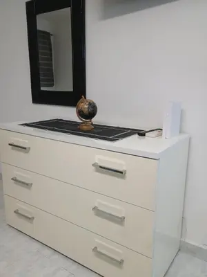 a dresser with a mirror on top of it at casa centro storico O Capu in Palermo