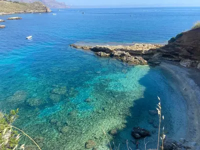 an aerial view of a beach with blue water at Addauro in Alcamo