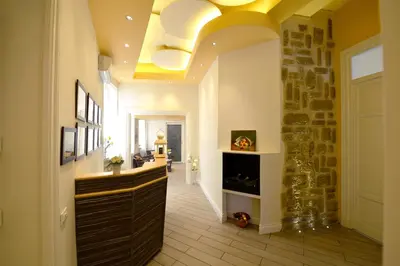 a hallway with a fireplace and a yellow ceiling at *1*7*4* Via Roma in Palermo
