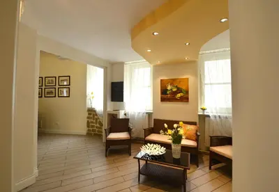 a living room with a couch and a table at *1*7*4* Via Roma in Palermo