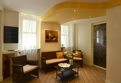 a living room with chairs and a table at *1*7*4* Via Roma in Palermo